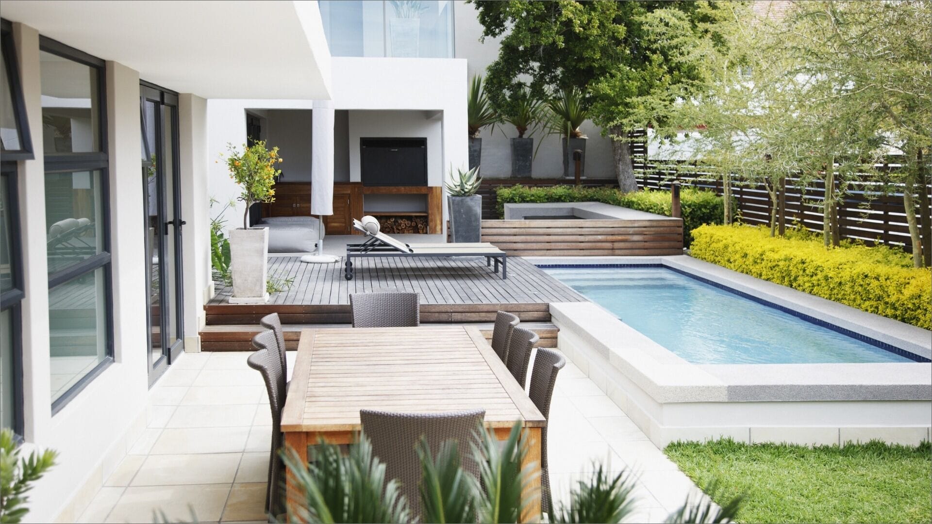 Luxurious backyard with outdoor dining and swimming pool