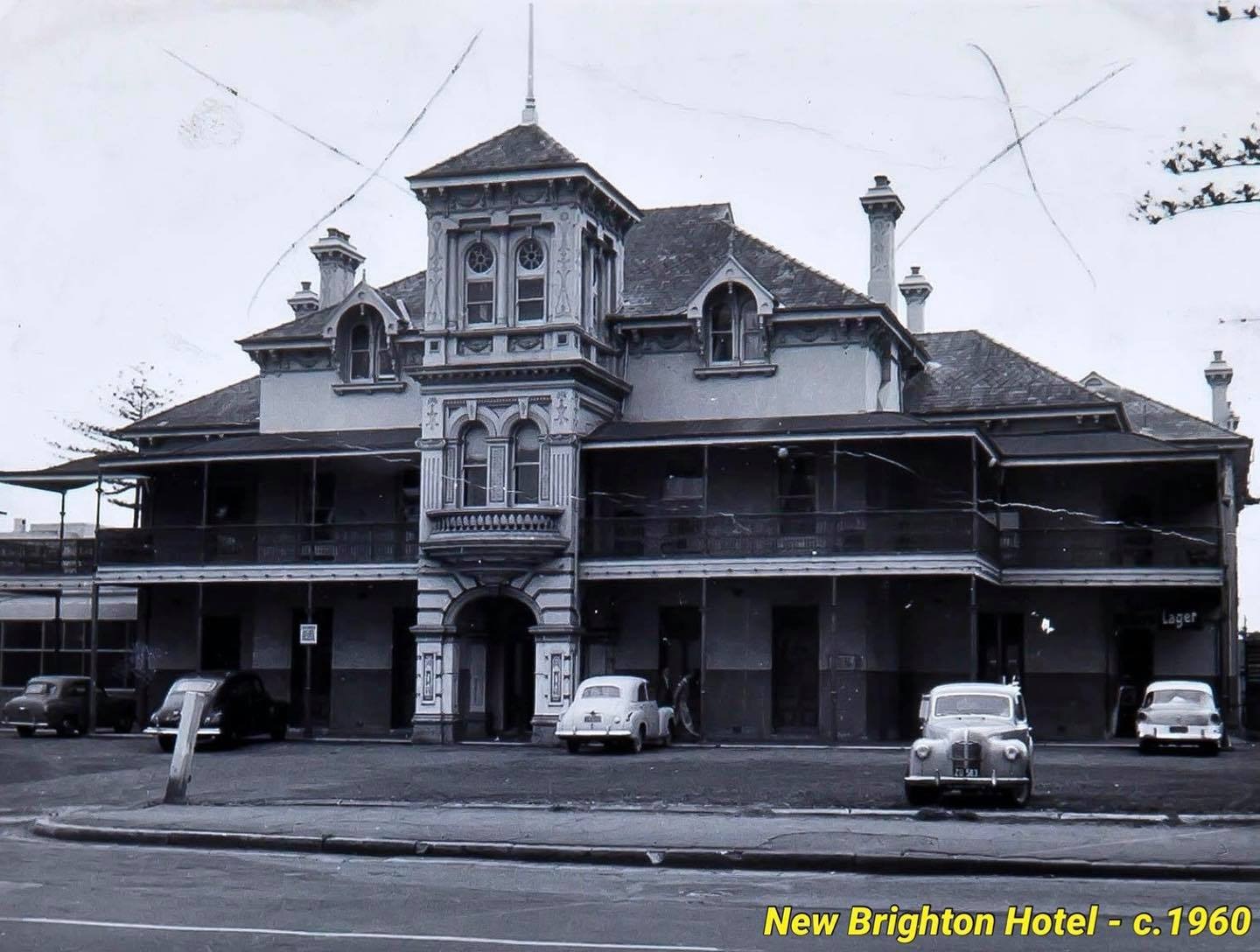 New Brighton Hotel circa 1960 showing the Victorian architecture with vintage cars parked outside